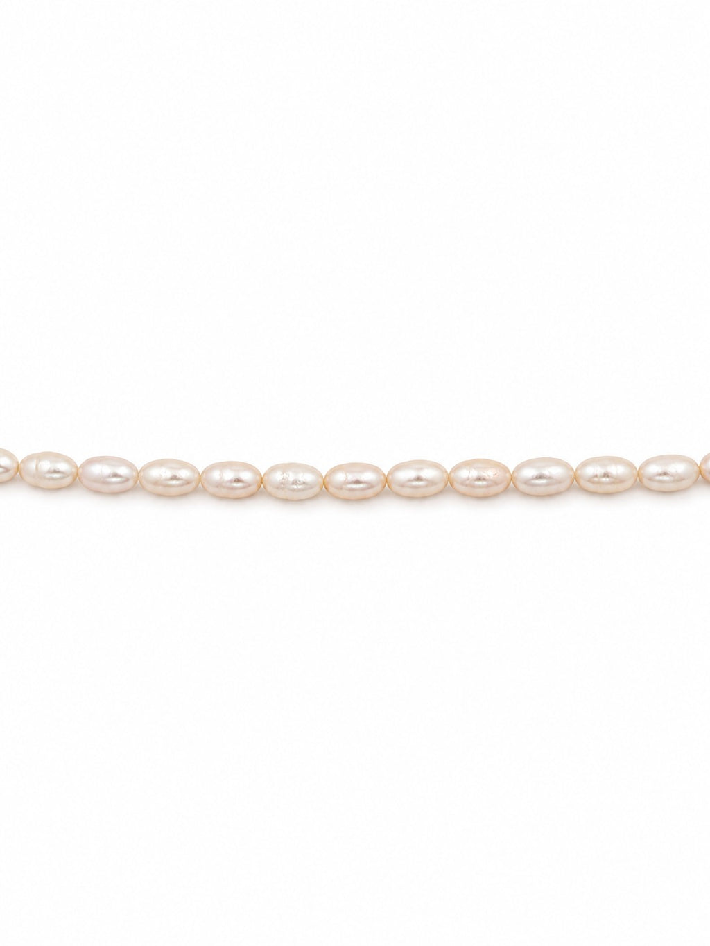Baby freshwater rice pearls on white background