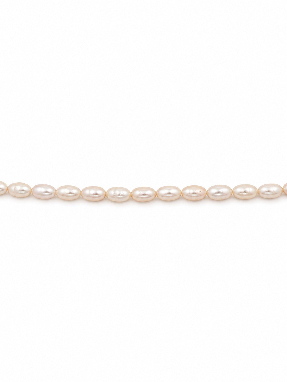 Baby freshwater rice pearls on white background