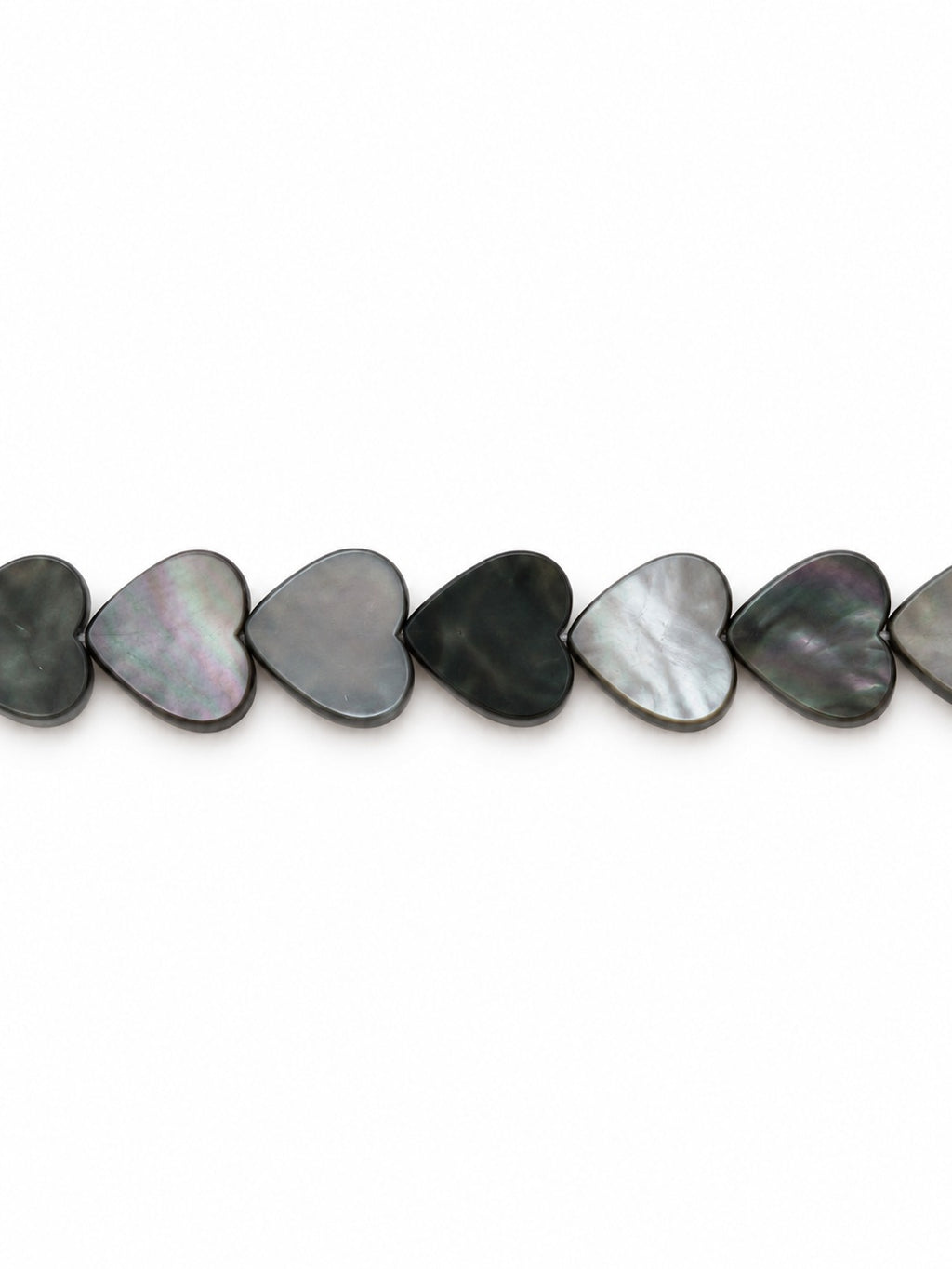 Black shell heart beads on white background
