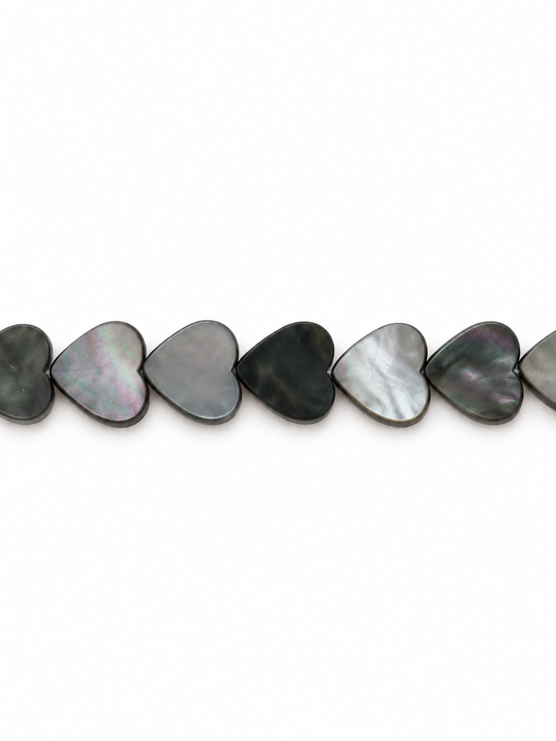 Black shell heart beads on white background