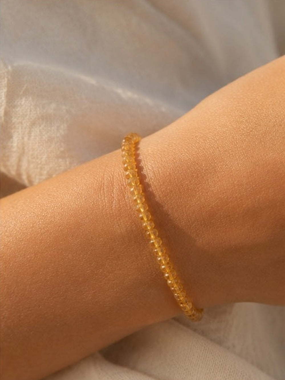 Citrine rondelle beaded bracelet on wrist