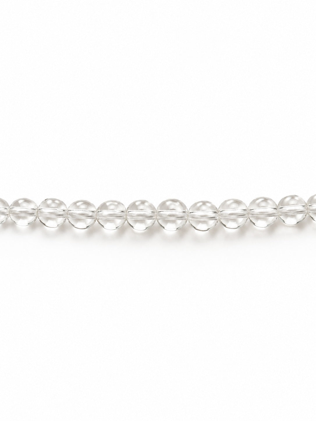 Clear handblown glass beads on white background