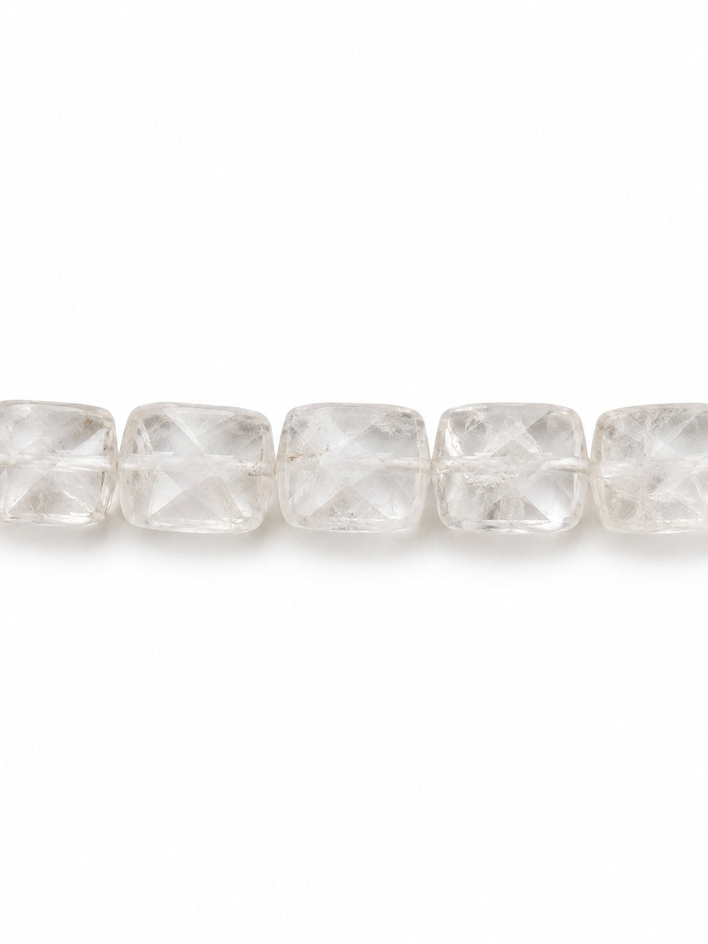 Clear quartz faceted square beads on white background