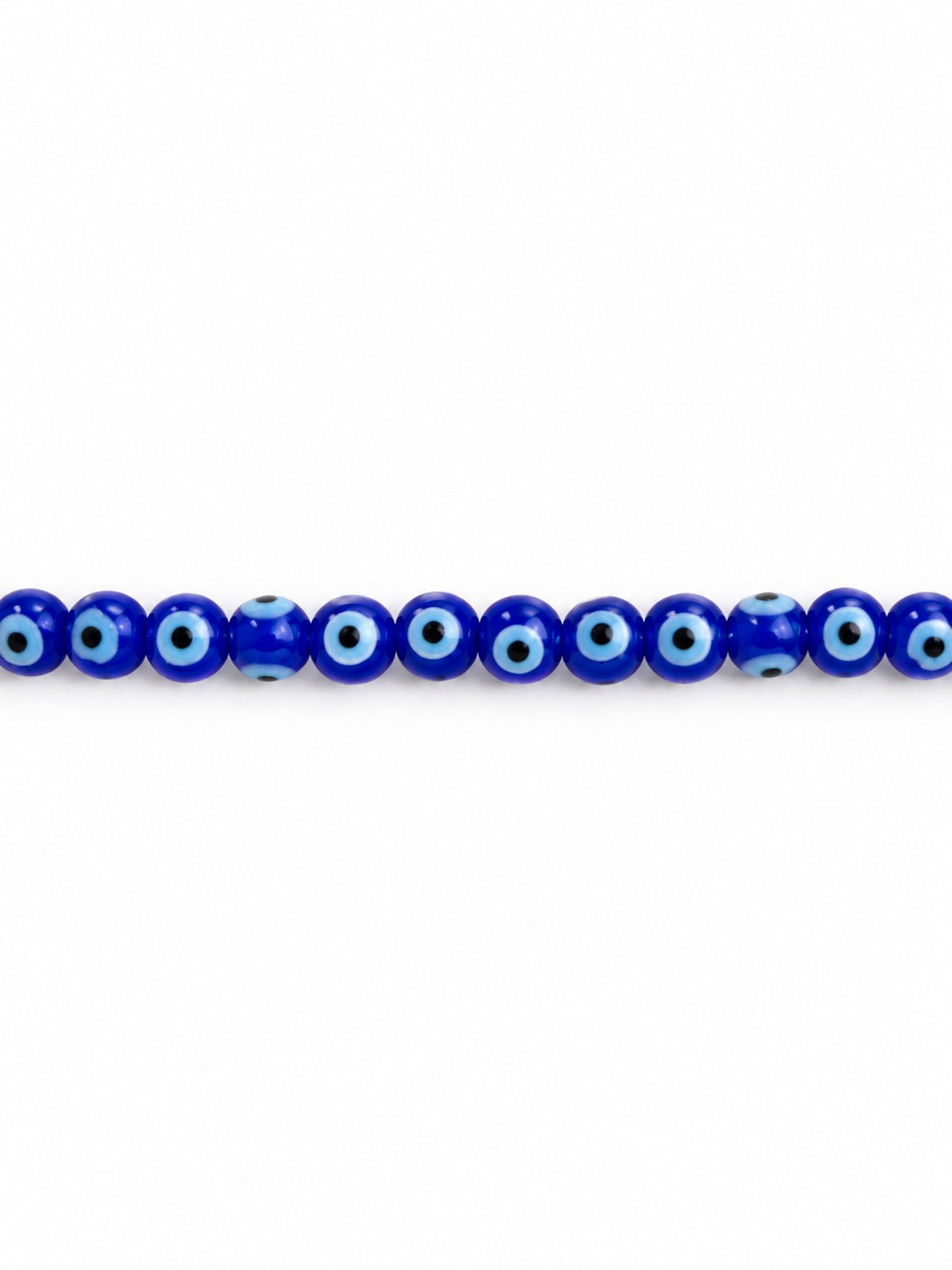 Blue evil eye glass beads on white background