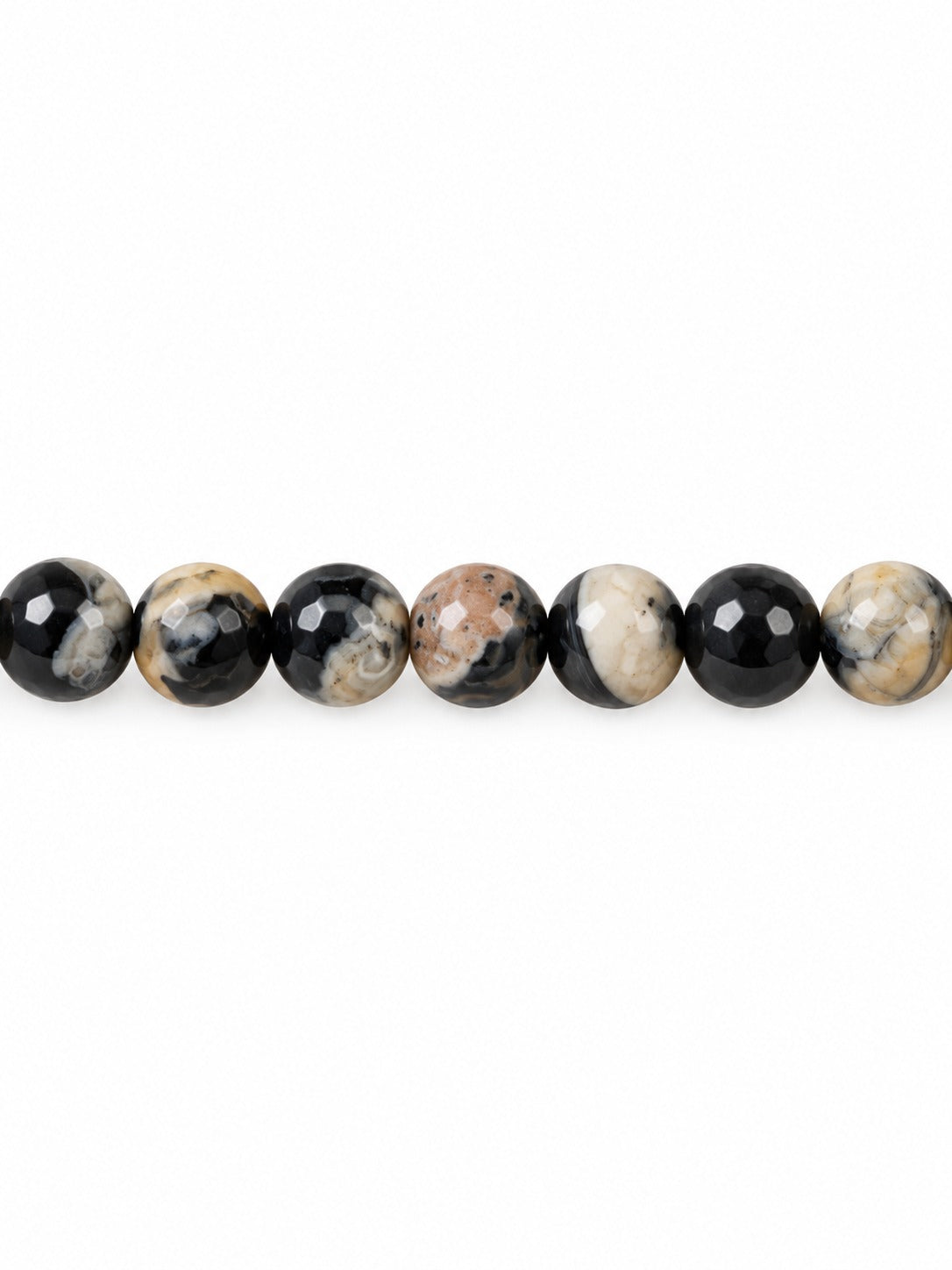 Fire agate faceted round beads on white background