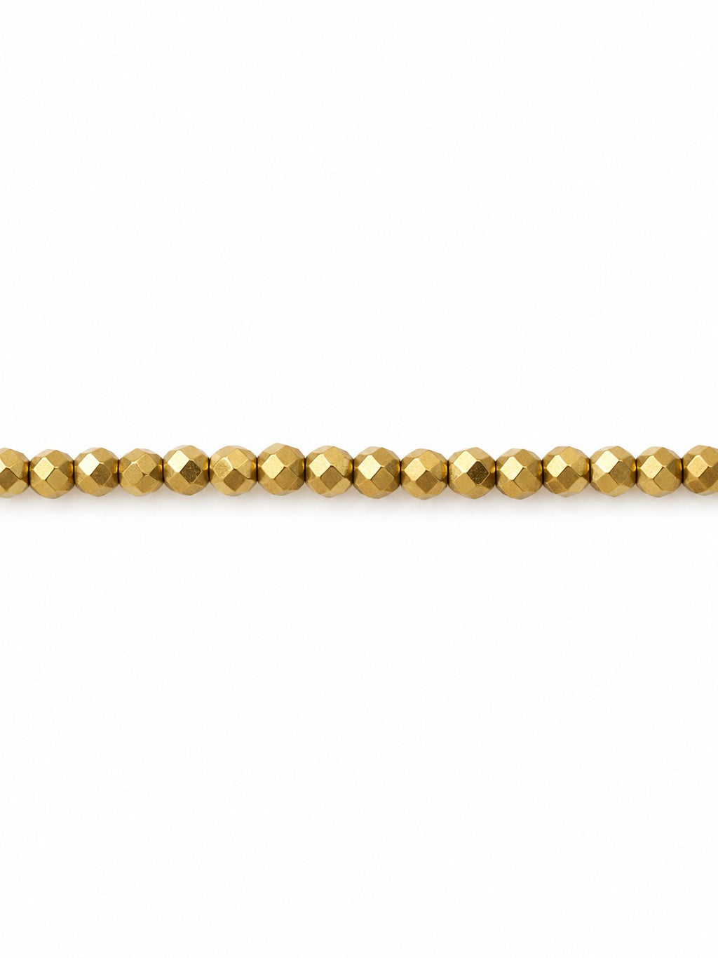 Gold faceted geo beads on white background