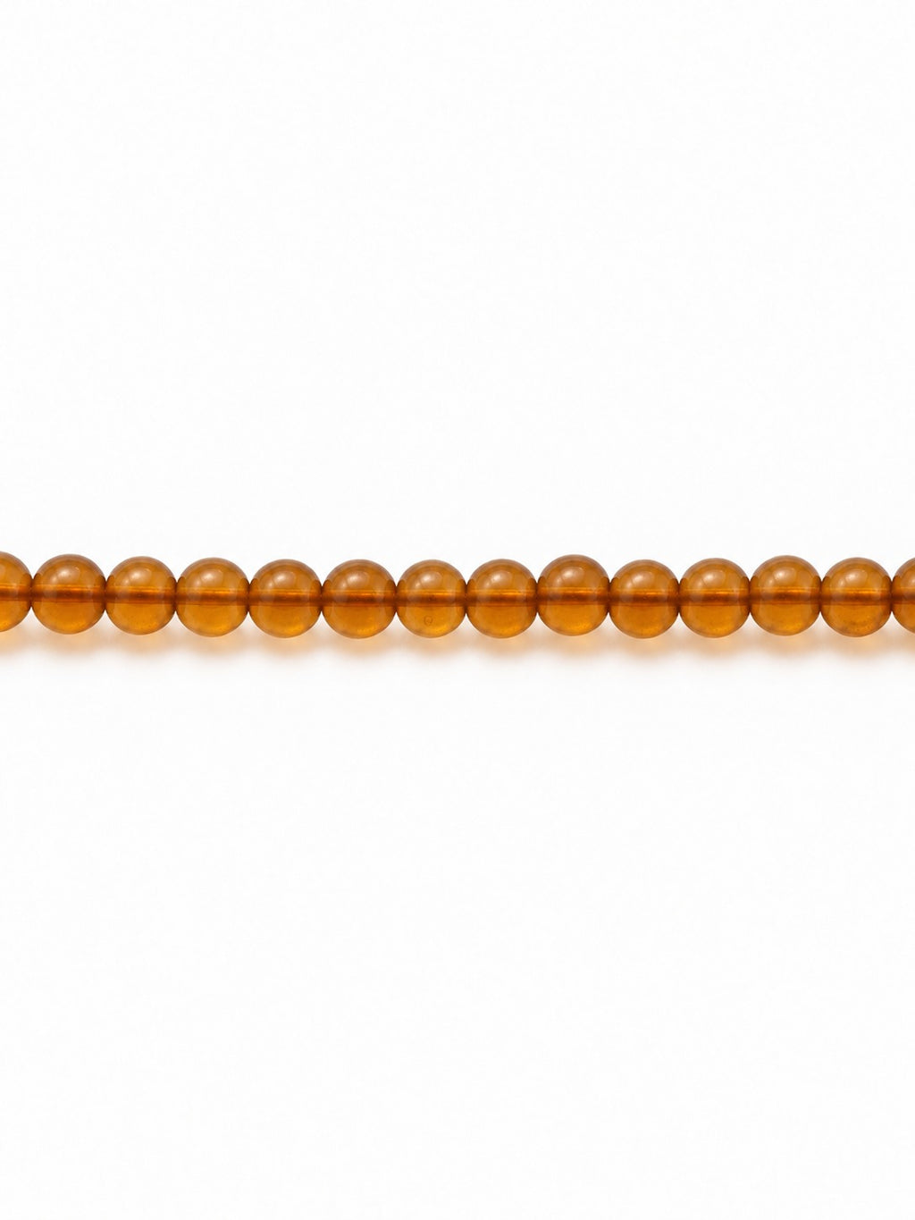 Honey handblown glass beads on white background