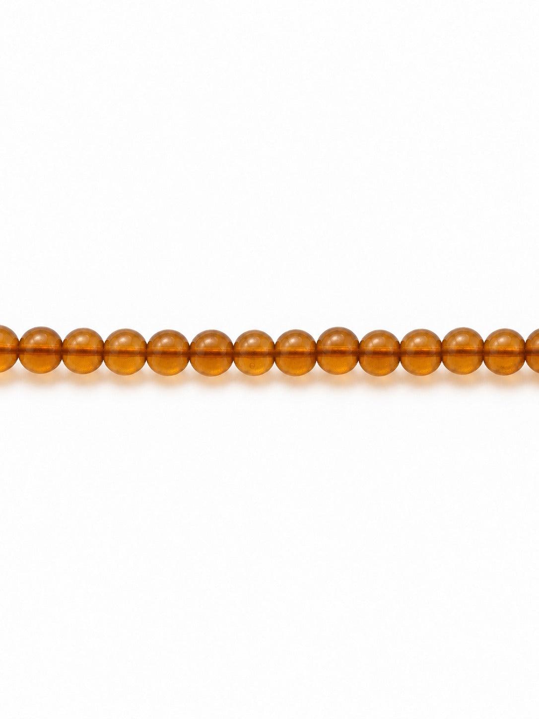 Honey handblown glass beads on white background