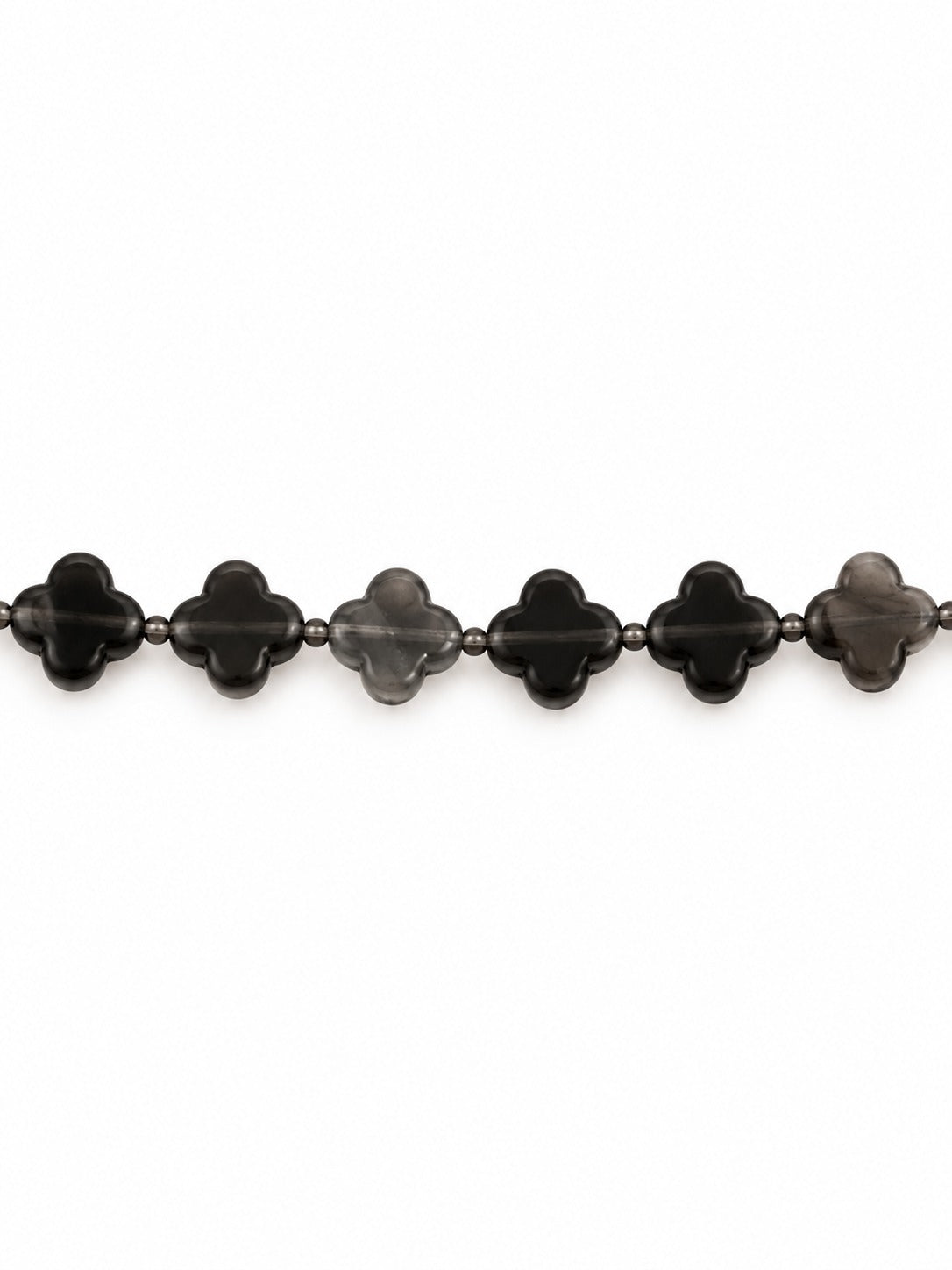 Ice obsidian clover beads on white background