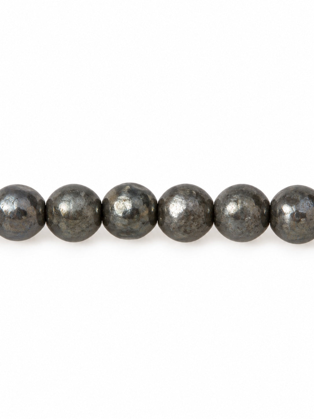 Metallic ice handblown glass beads on white background