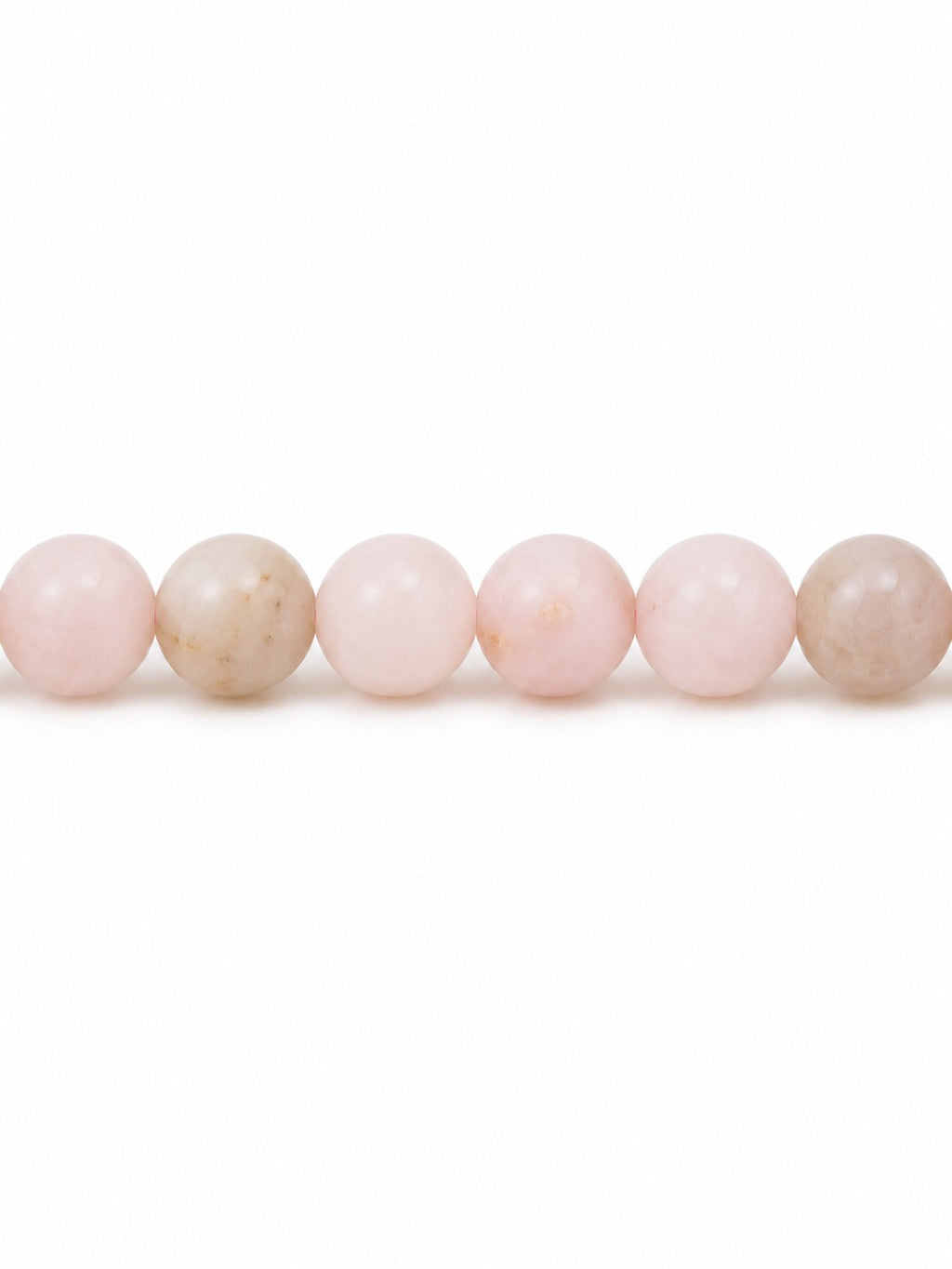 Pink opal round beads on white background