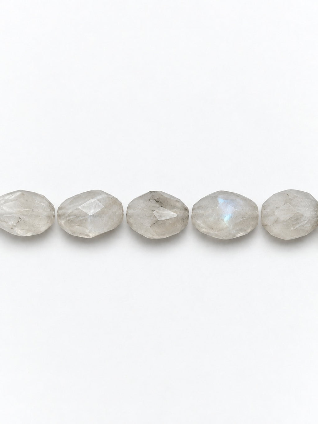 Rainbow moonstone faceted oval beads on white background