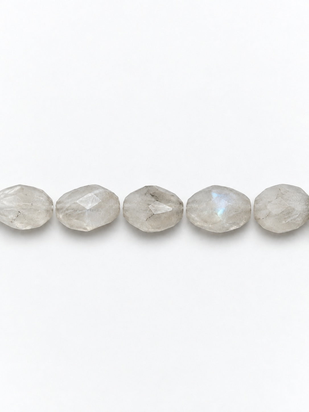 Rainbow moonstone faceted oval beads on white background