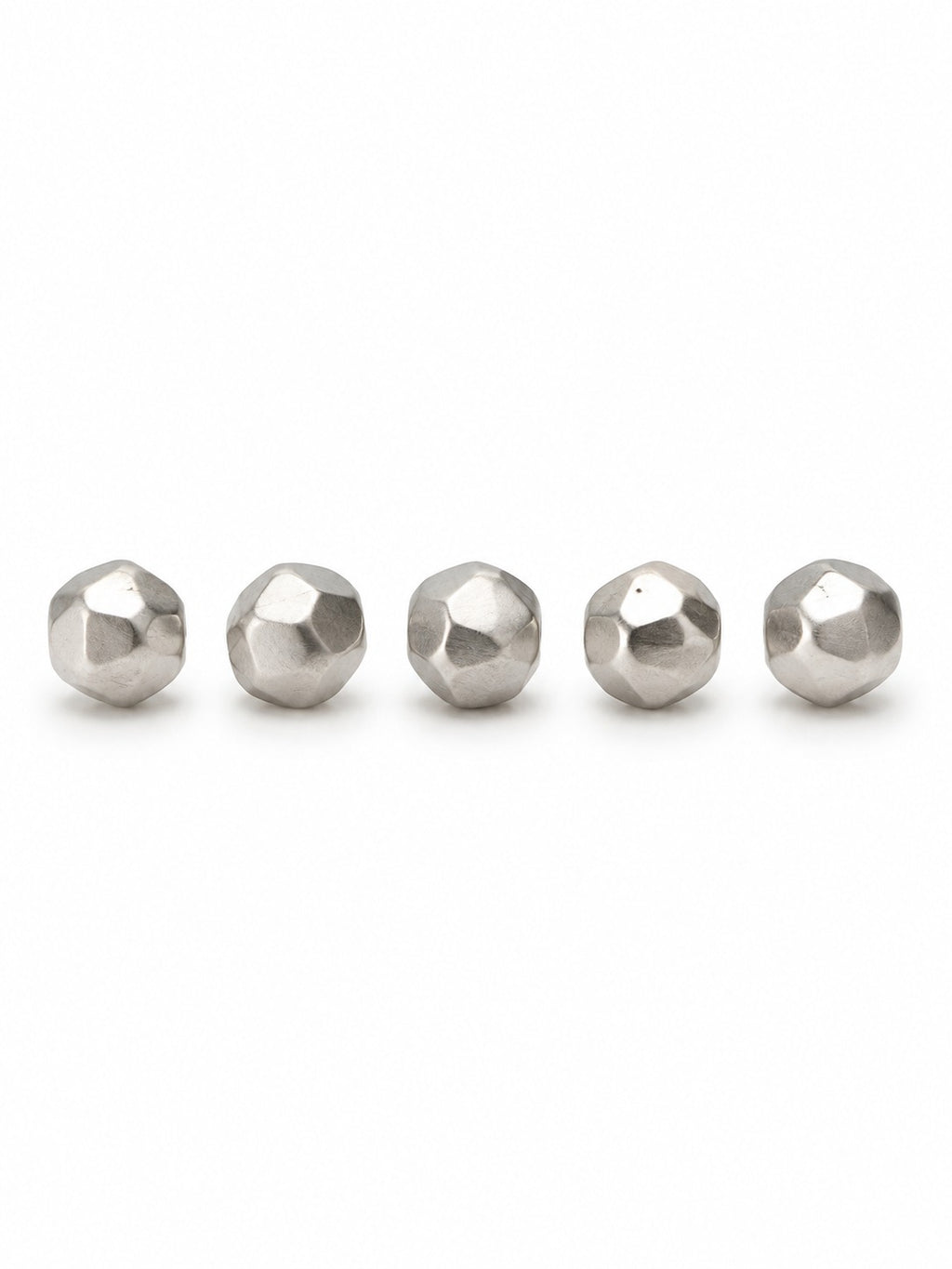 Silver faceted geo beads on white background