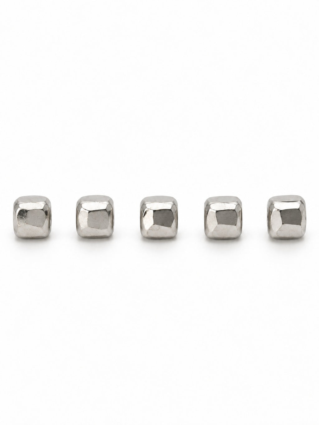 Silver faceted square beads on white background