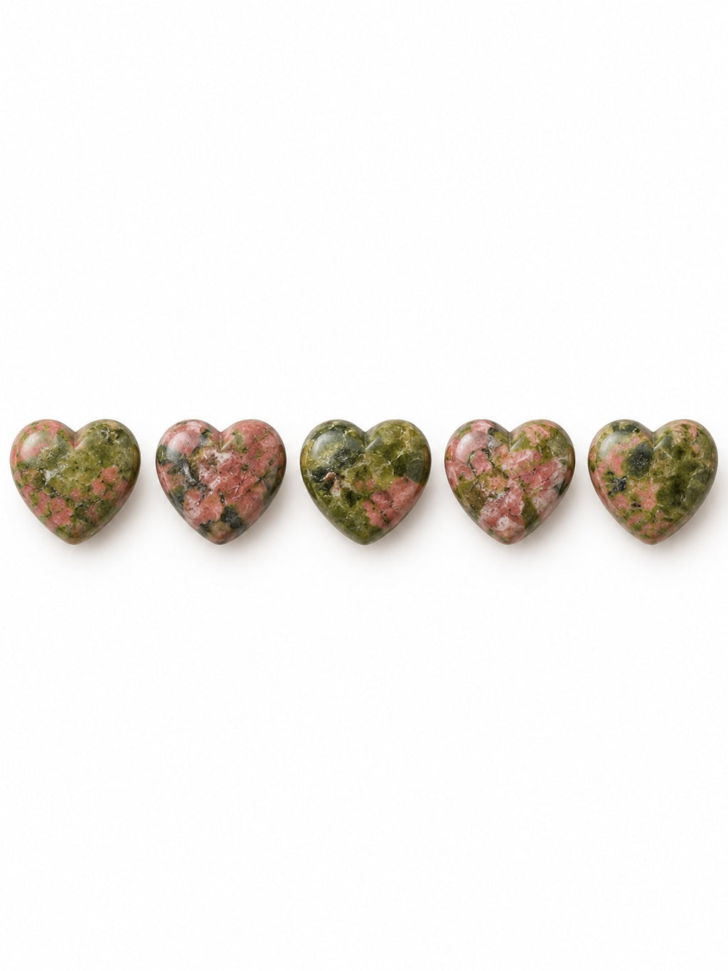 Unakite heart beads on white background