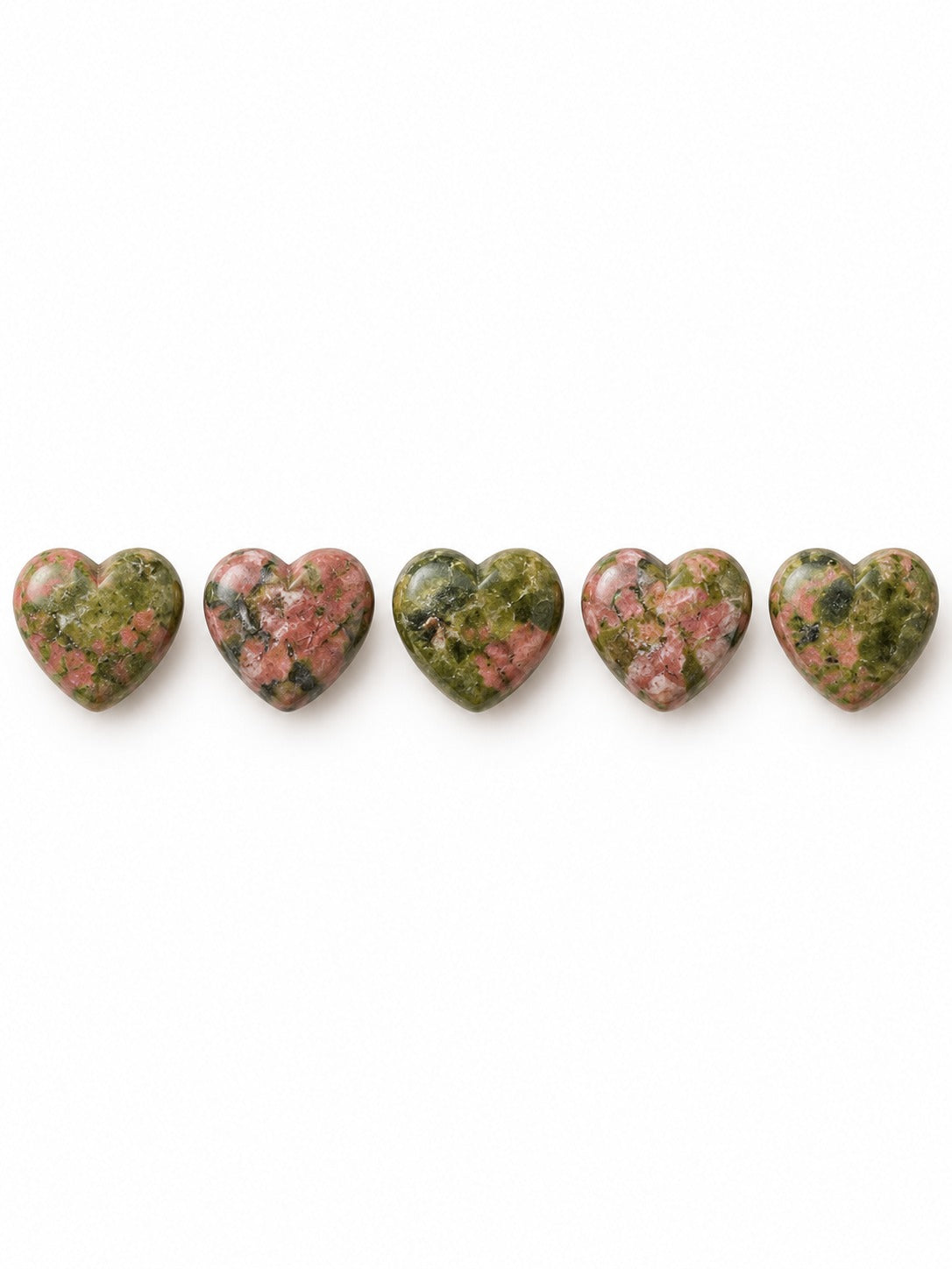 Unakite heart beads on white background
